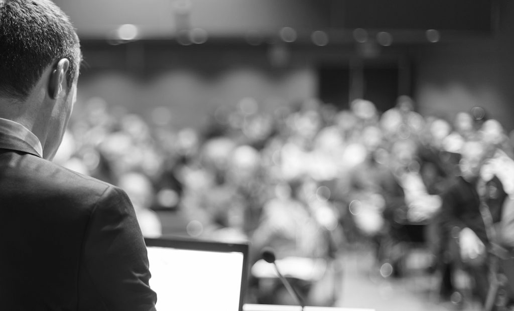 Speaker at Business Conference and Presentation. Audience at the conference hall.